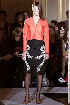 red fitted jacket with black pencil skirt