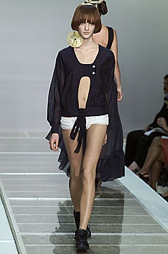 black fitted top with cutout and white shorts