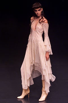 beige silk tiered dress with white boots