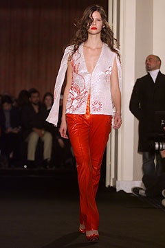 white silk embroidered top with red leather pants