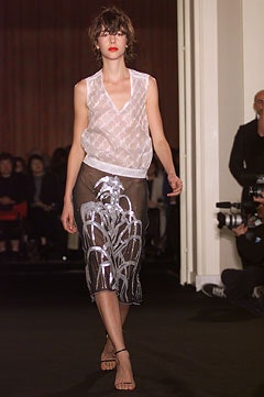 white silk sleeveless top and black midi skirt