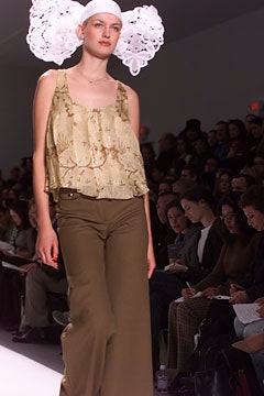 beige ruffled top and brown wide-leg pants