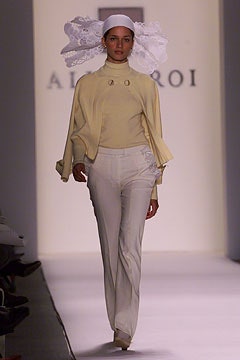 yellow fitted top and white tailored pants