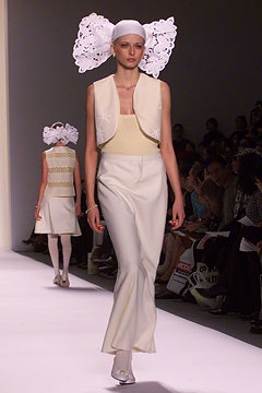 beige fitted top with white vest