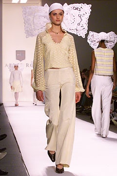 white relaxed top with beige pants