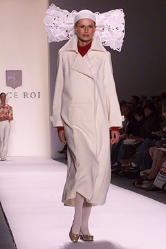 white wool fitted coat and red top