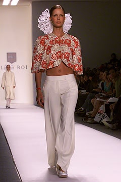 embroidered red and white top with relaxed white pants