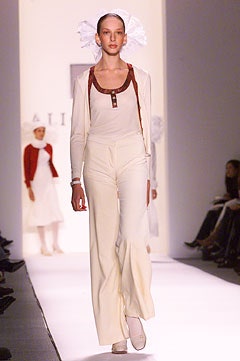 white sleeveless top with beige pants