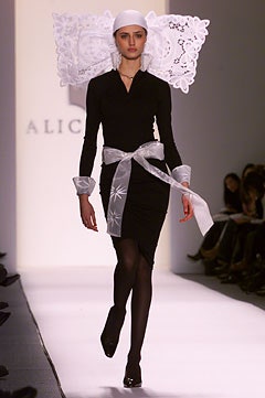 black fitted mini dress with white belt