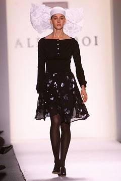 black fitted top and flared skirt
