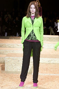 green fitted jacket with black top