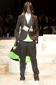black tailored suit with green vest