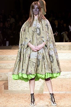 beige silk layered cape with purple pants