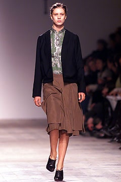 black jacket green top brown skirt