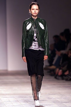 green leather fitted jacket with printed top and black midi skirt