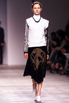 white fitted top and black midi skirt