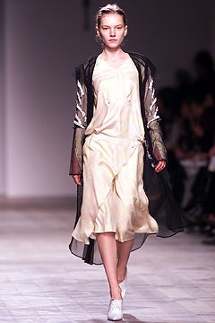 yellow silk midi dress with black coat