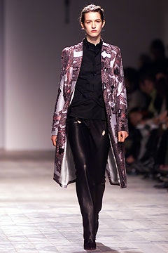 purple embroidered coat with black shirt and leather pants