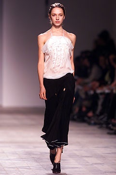 white silk halter top and black midi skirt