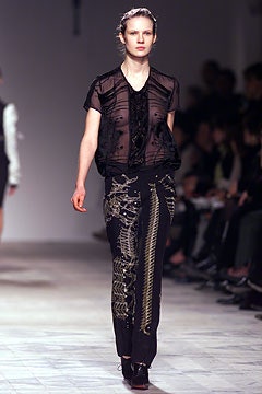 black sheer top with slim pants