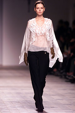 white ruffled blouse with black pants