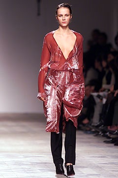 red silk draped dress with black pants