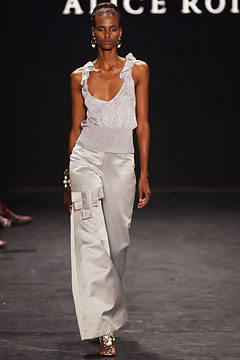 white ruffled top and silver wide-leg pants