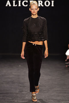 black ruffled top and velvet pants