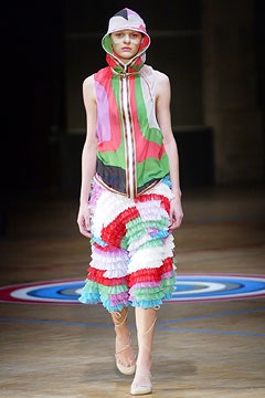 color-blocked top and pleated skirt