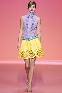 purple ruffled top and yellow skirt