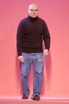 black wool turtleneck sweater and blue jeans