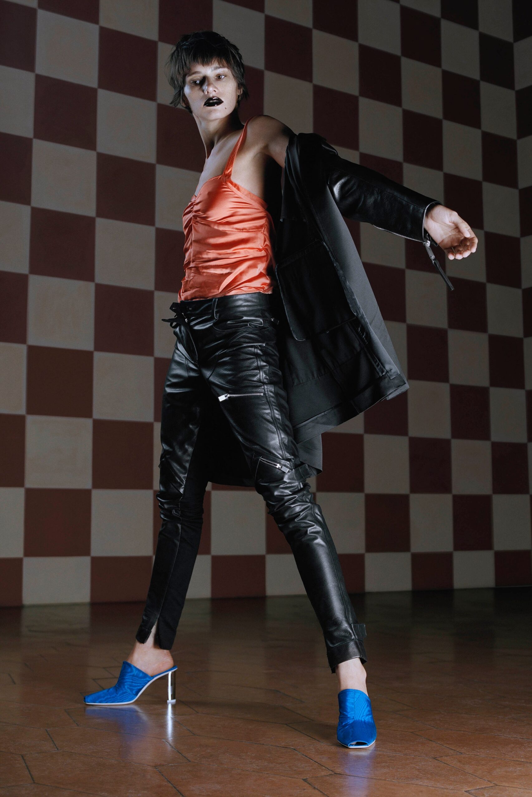black leather coat orange silk top
