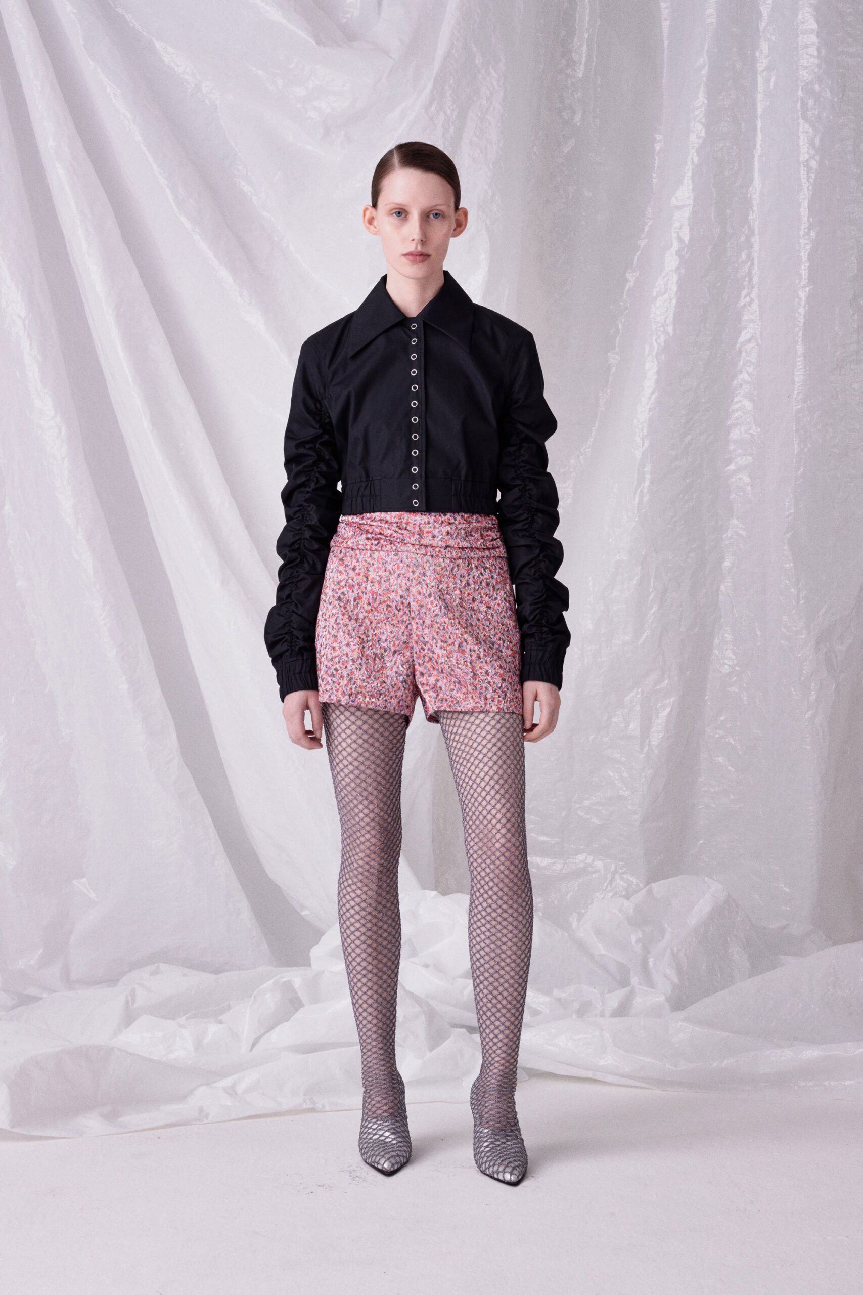 black fitted shirt with pink shorts