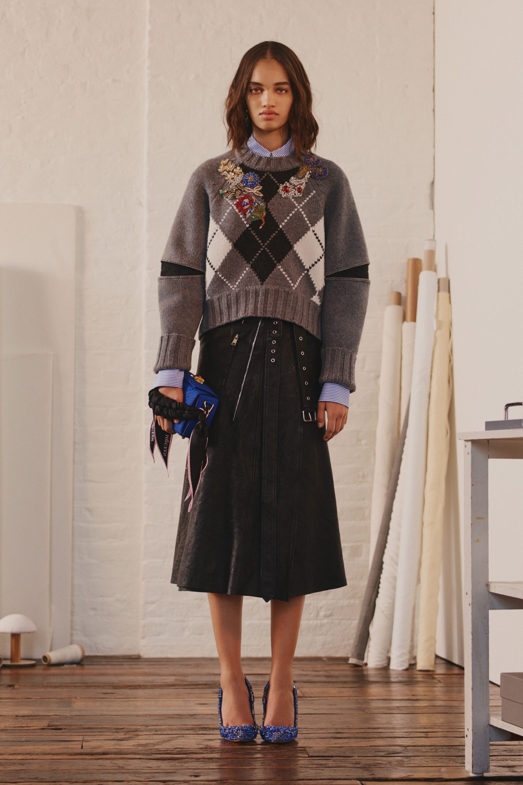gray wool sweater and black leather skirt