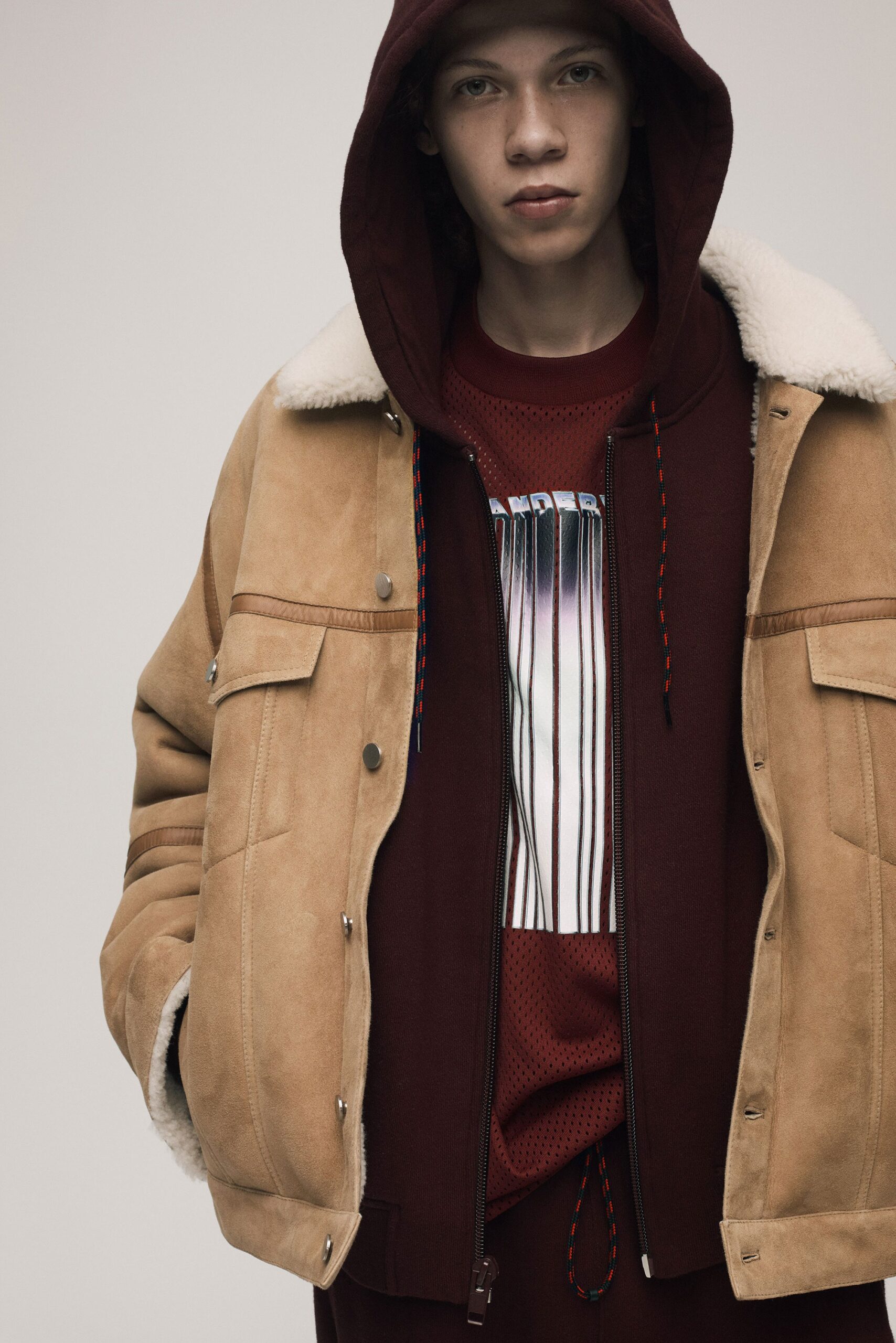 brown suede jacket with red hoodie