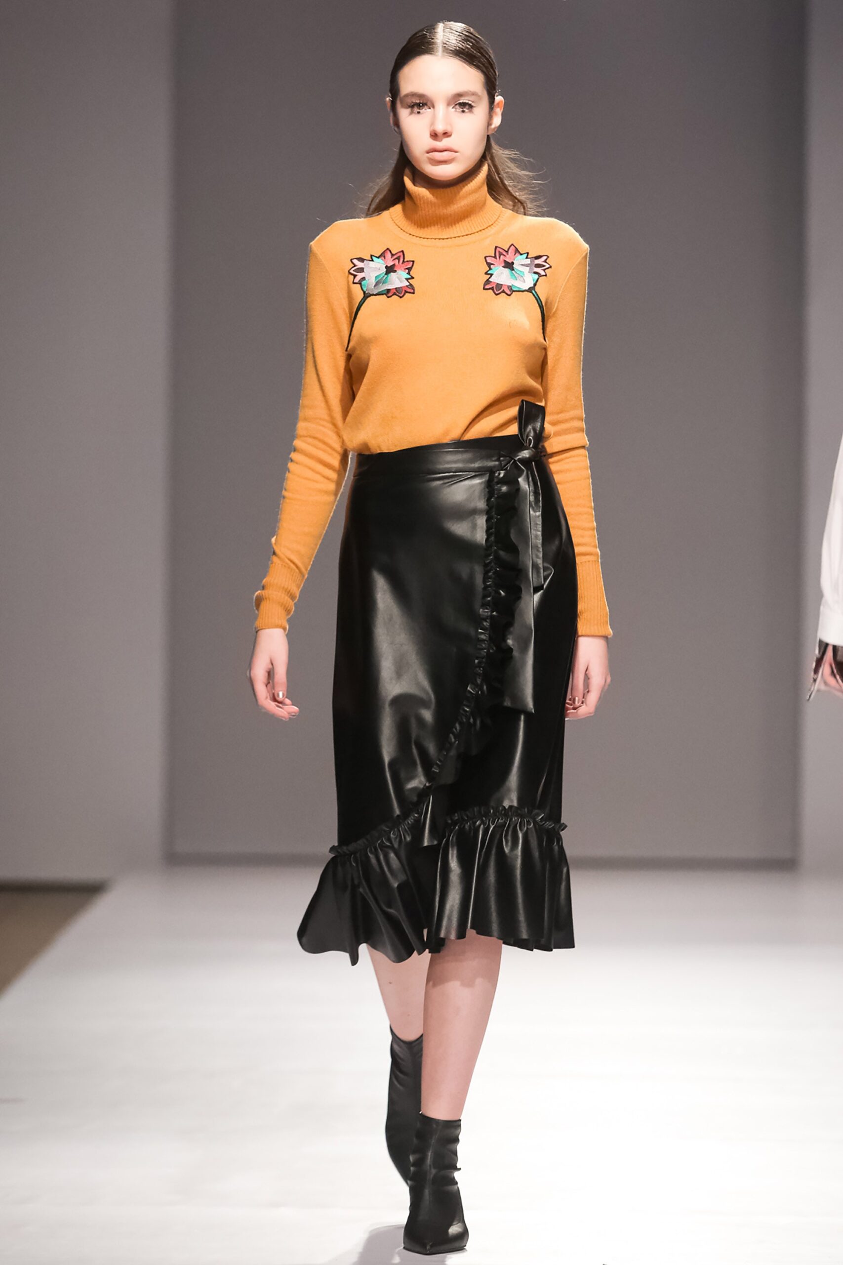 orange fitted top with embroidered details