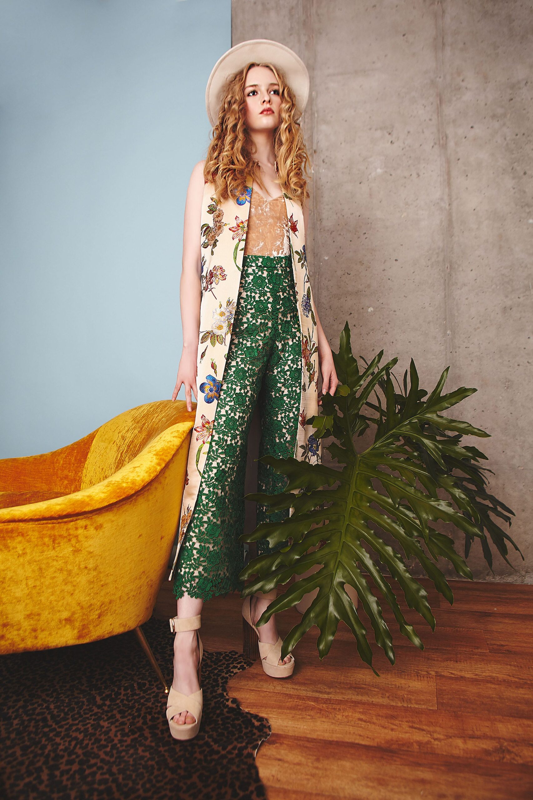 white embroidered vest with green pants