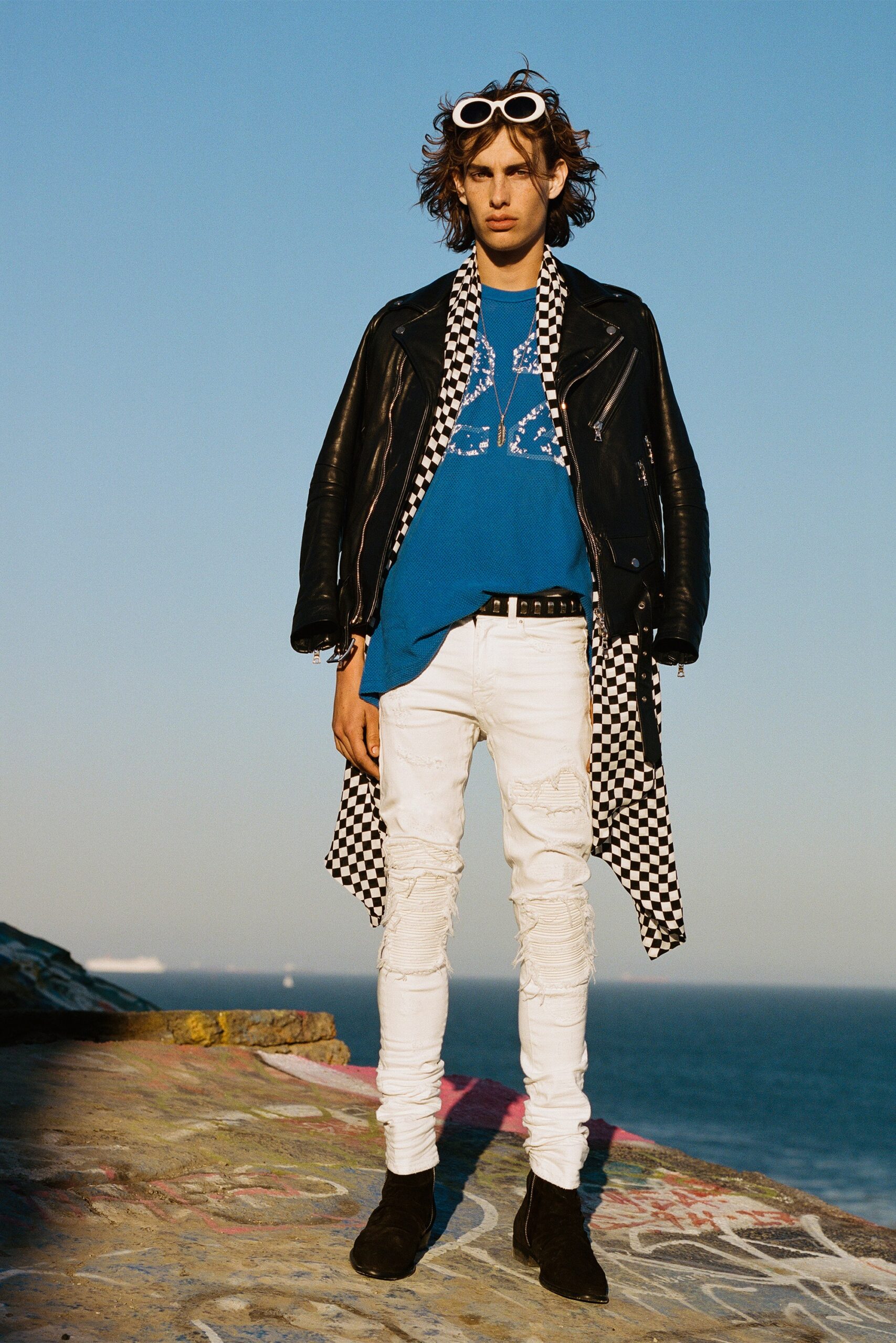 black leather coat with blue t-shirt