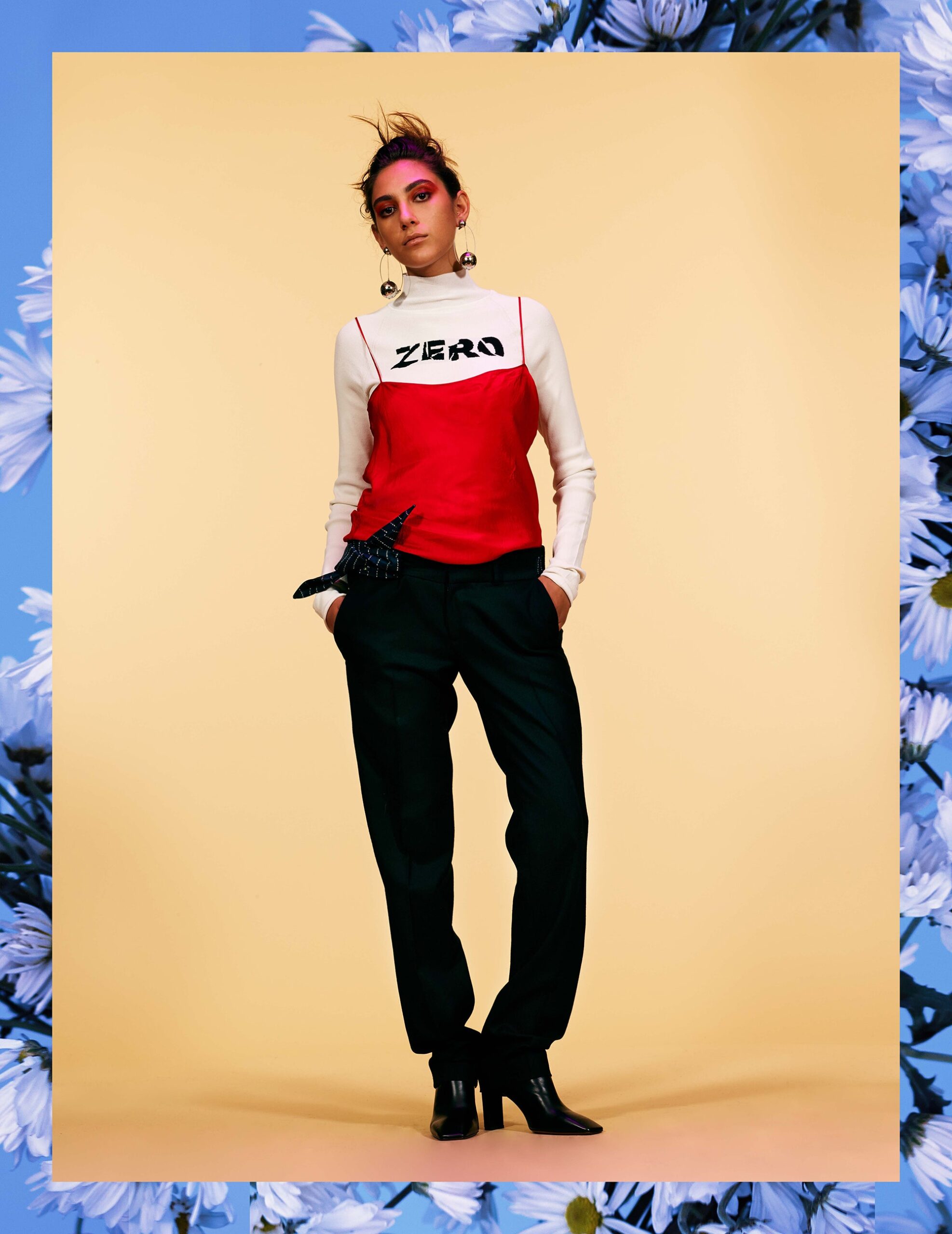 red and white fitted top with black pants