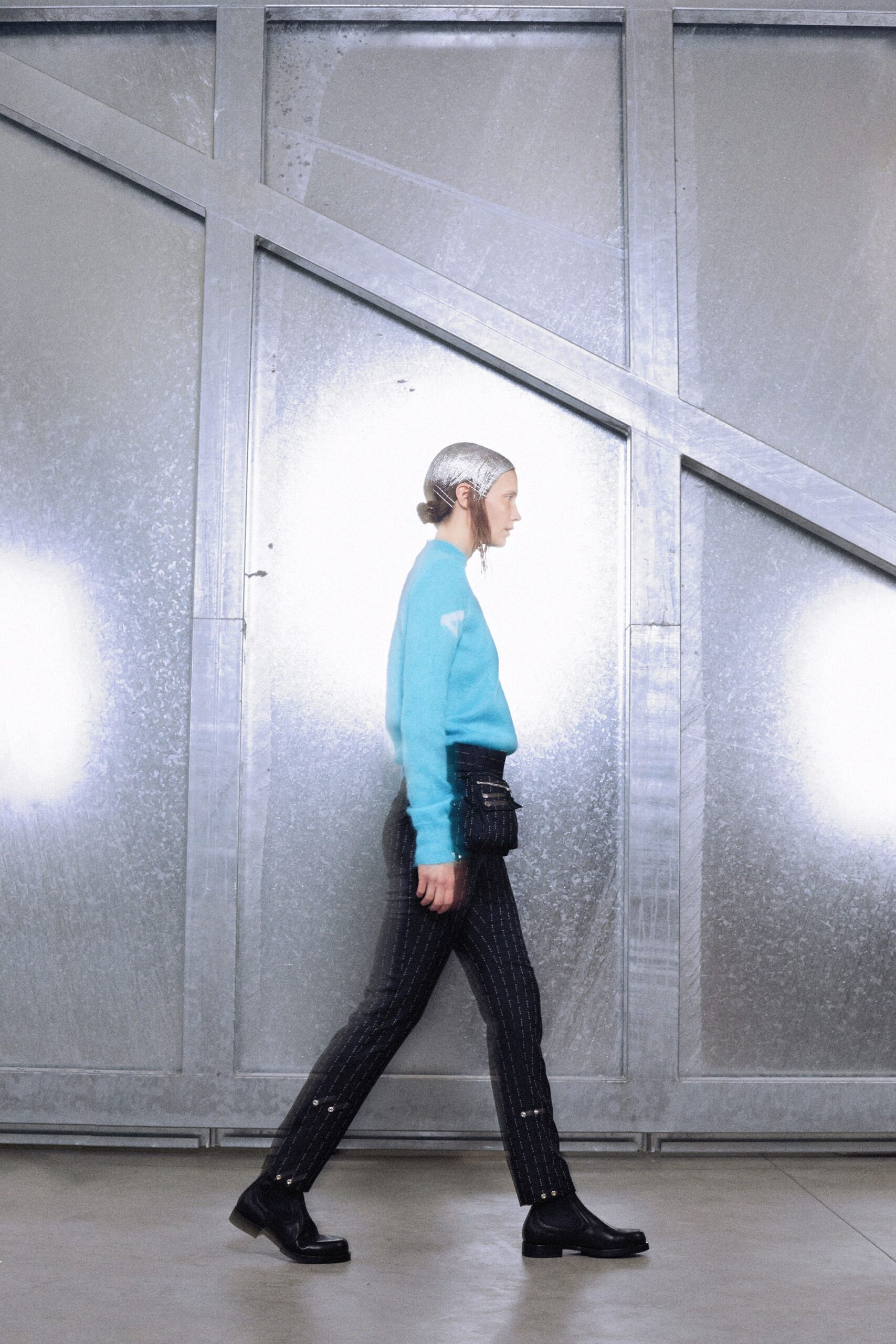 blue fitted sweater with black pants