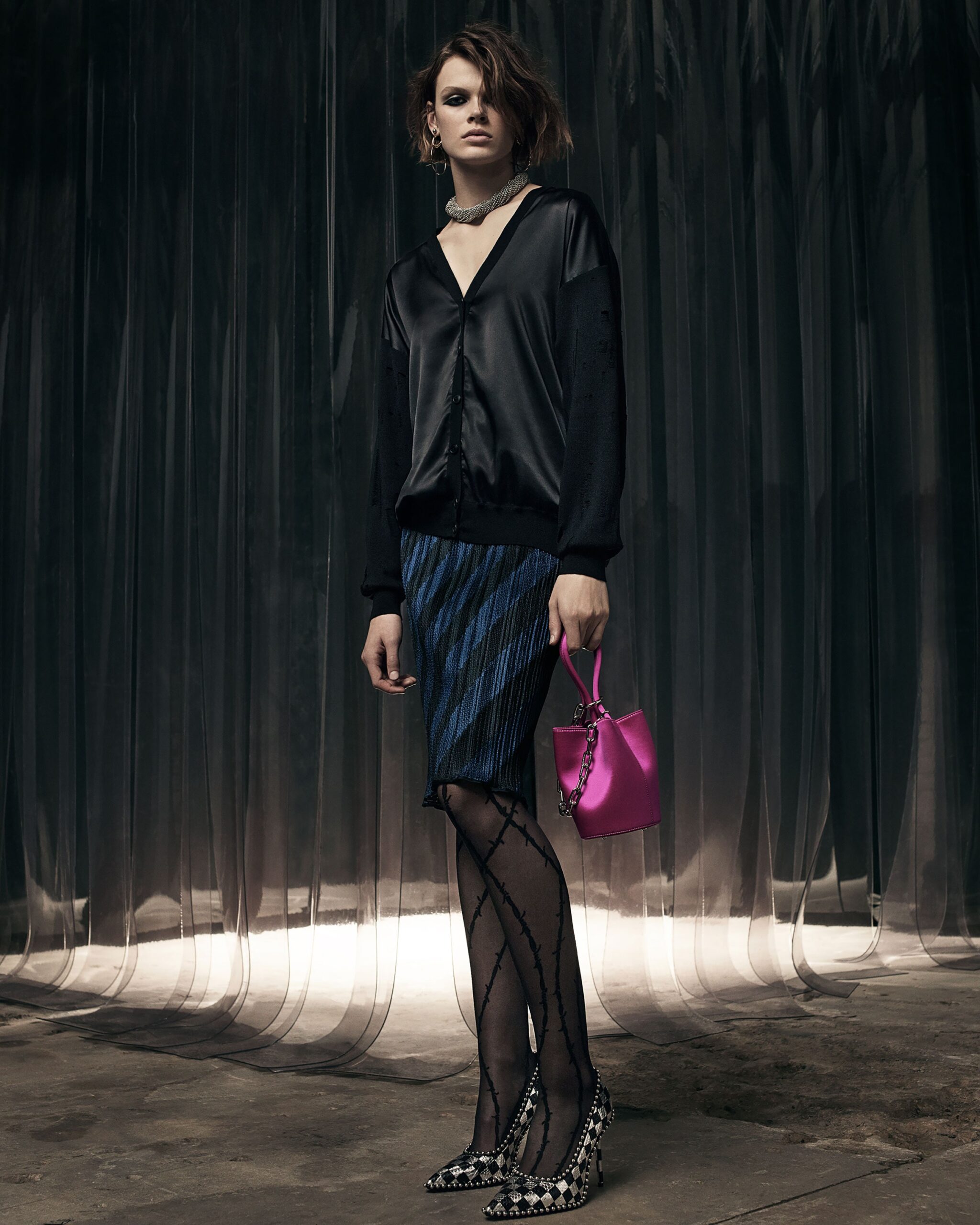 black silk fitted top with pleated blue mini skirt