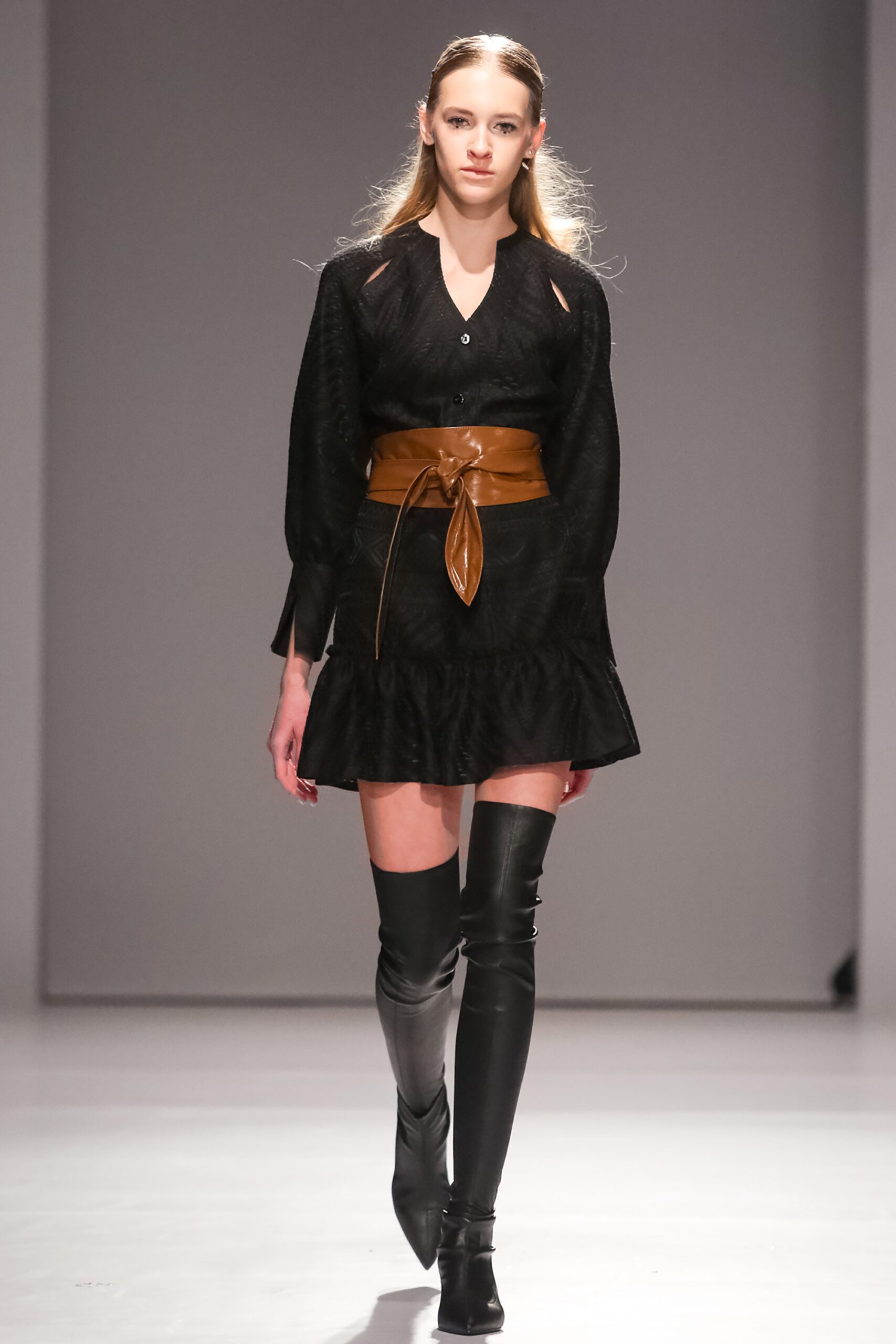 black mini dress with brown belt