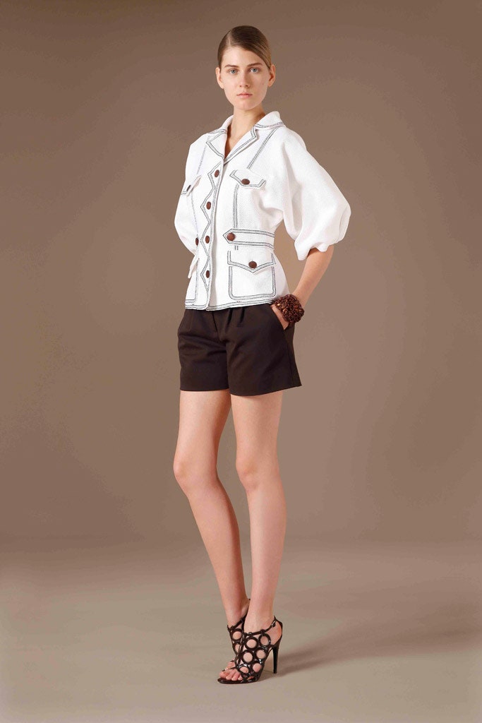 white relaxed top with black shorts
