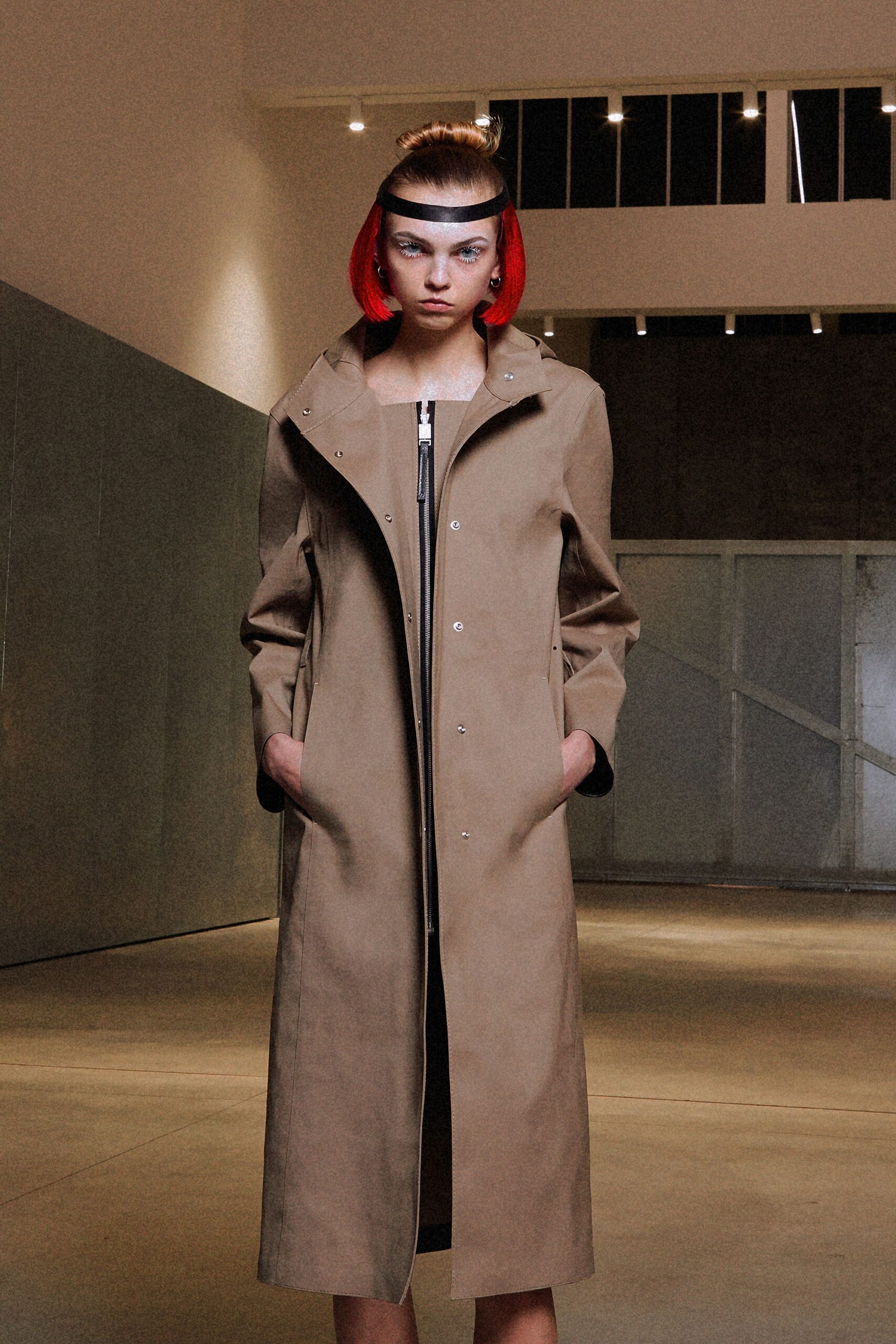 beige coat and black midi dress