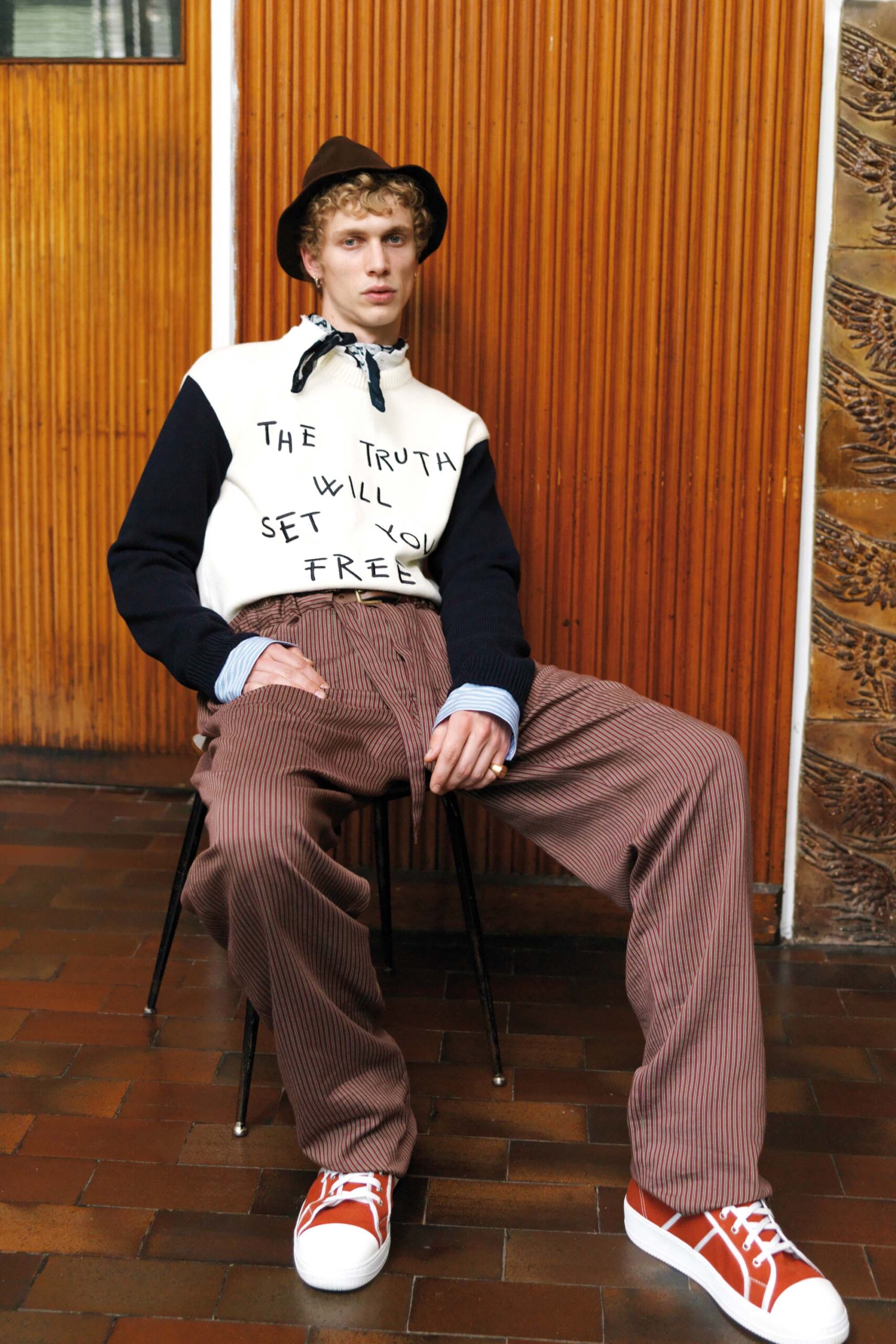 relaxed black and white sweater with striped pants