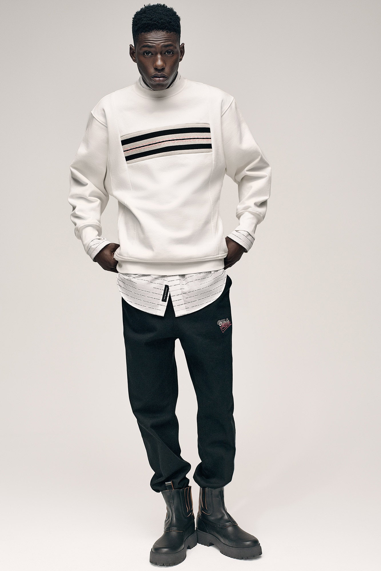 white relaxed sweater with black pants