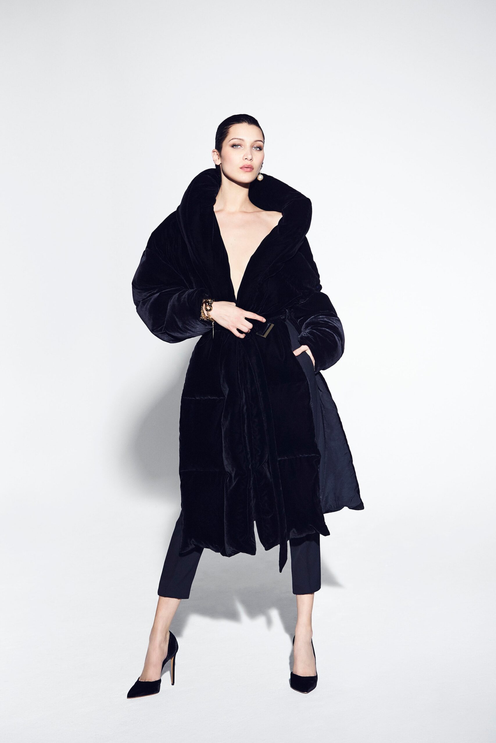 black faux-fur coat with tailored pants