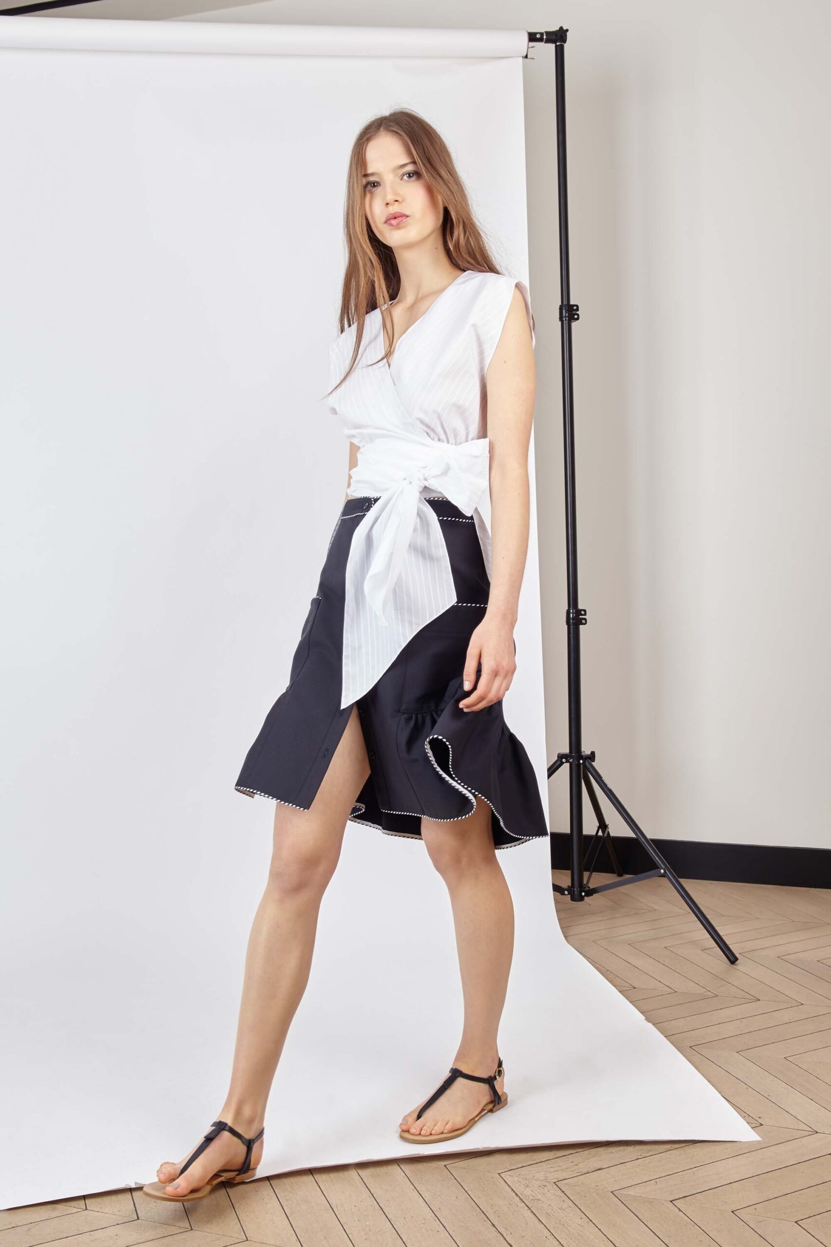 white fitted top with black skirt