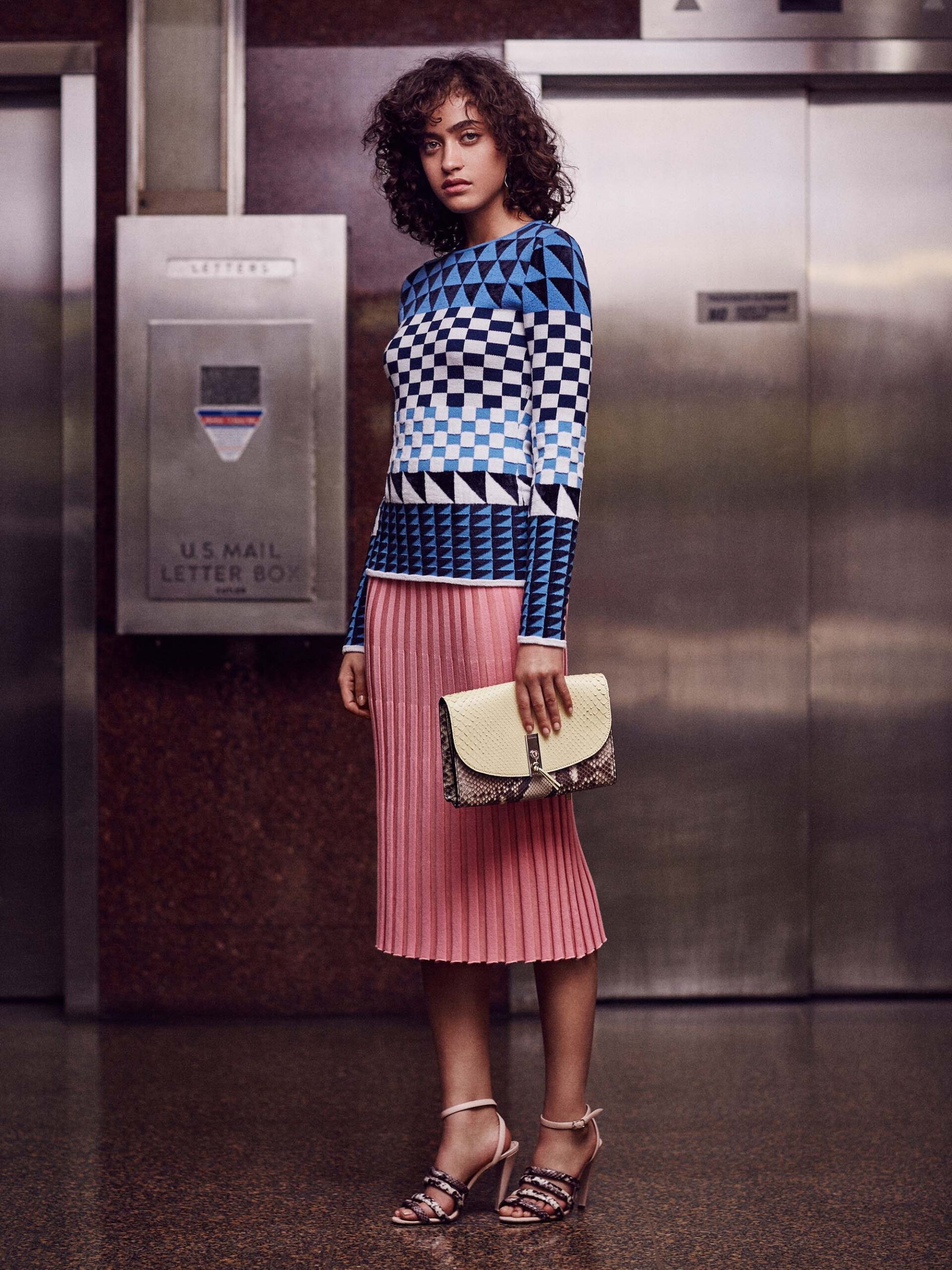 fitted blue printed top with pleated pink skirt