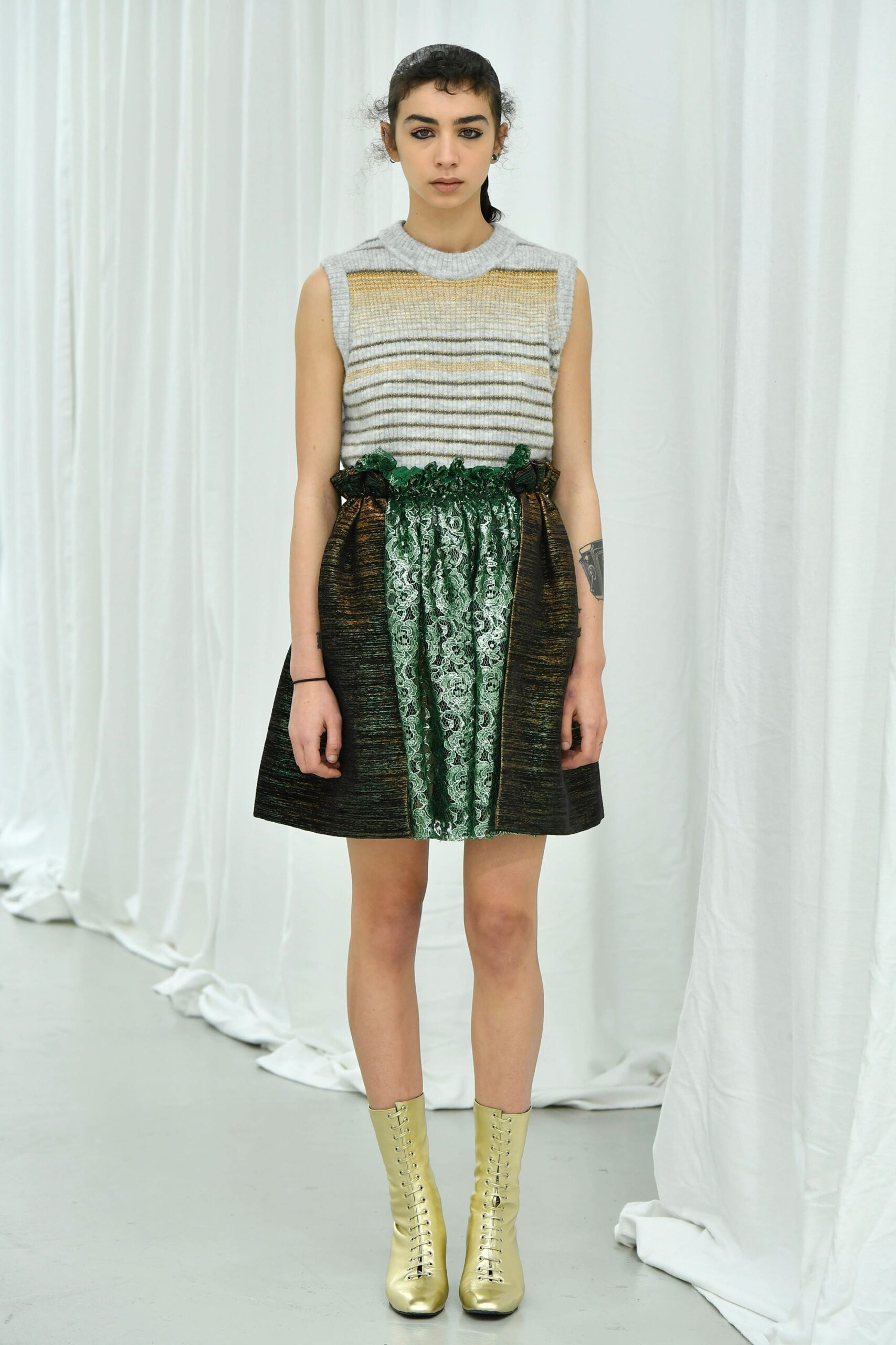 gray striped sleeveless top with mini skirt